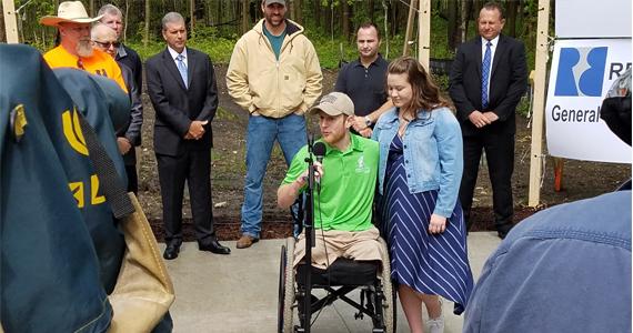 Marine Corporal Kyle Moser receives the key to his Jared Allen Home for Wounded Warriors